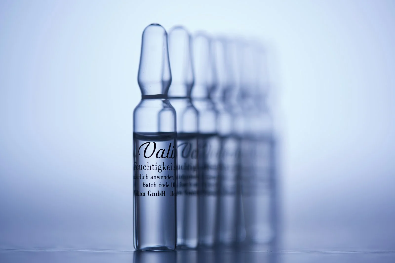 a row of empty bottles sitting on top of a table