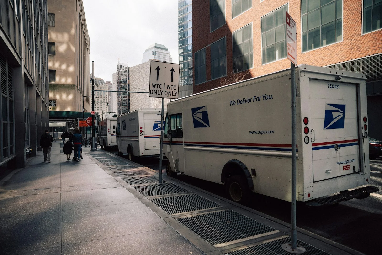 a mail truck parked on the side of a street