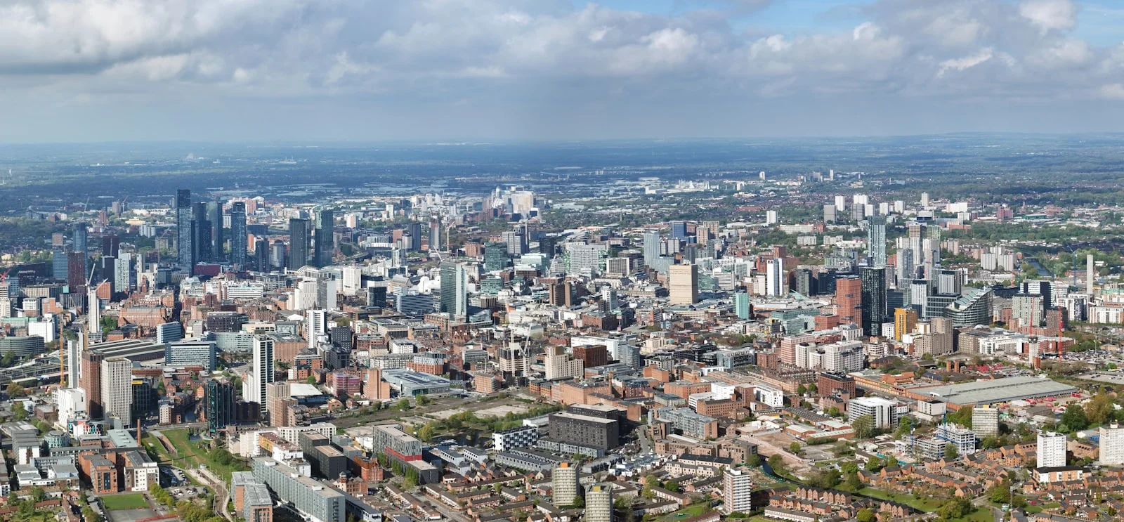 an aerial view of a city with tall buildings