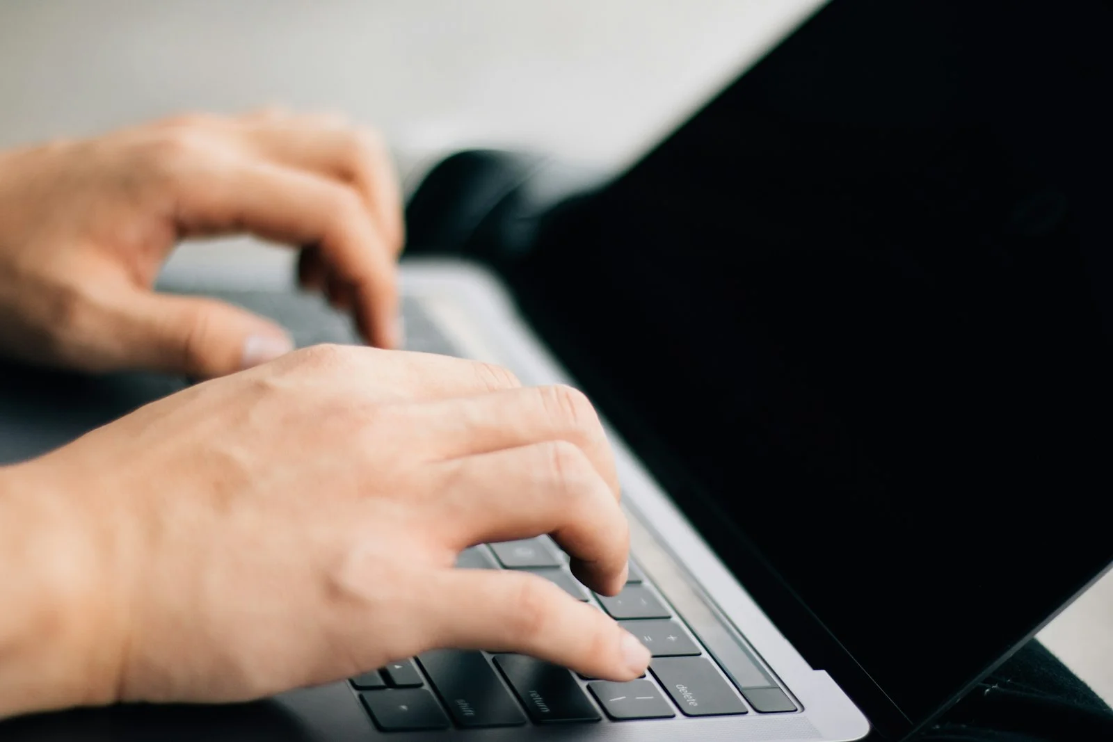 person using black and gray laptop computer person using black and gray laptop computer